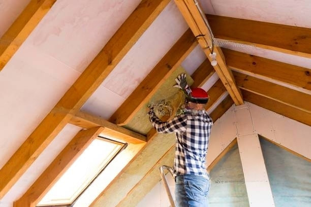 man-installing-roof-insulation-transformed